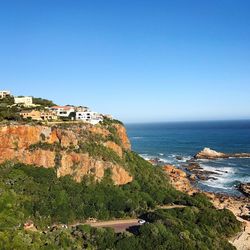 Scenic view of sea against clear blue sky