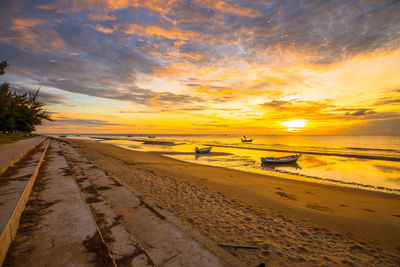 Scenic view of beach against sky during sunset