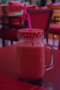 Close-up of drink in glass jar on table