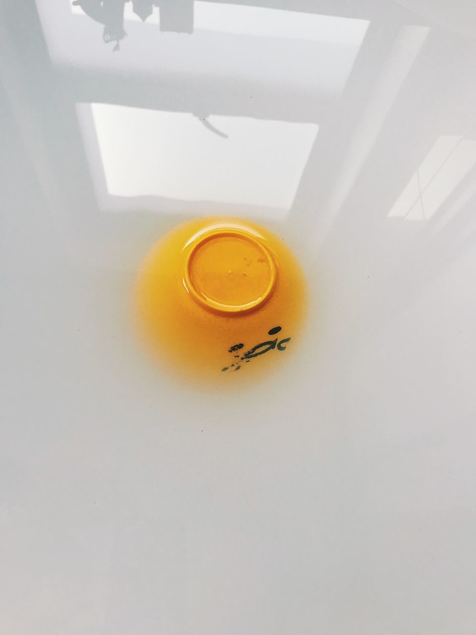 HIGH ANGLE VIEW OF COFFEE CUP ON WALL