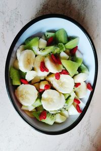 Directly above shot of fruit salad in bowl on table