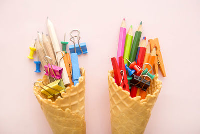 High angle view of multi colored pencils on white background