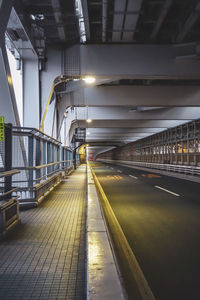 Illuminated bridge in city