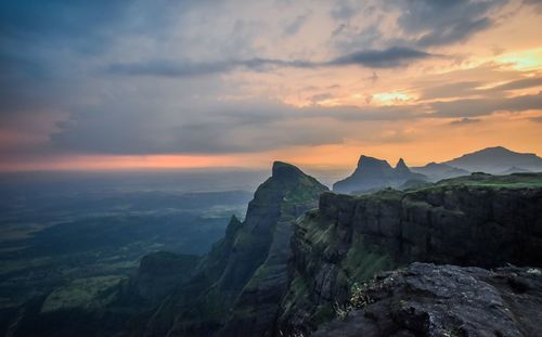 Scenic view of mountains against sky during sunset