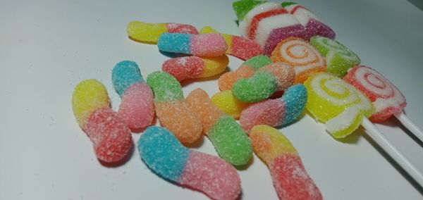 High angle view of multi colored candies in plate
