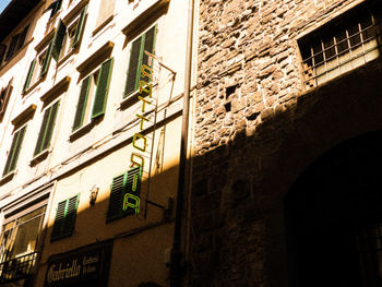 Low angle view of text on wall of building