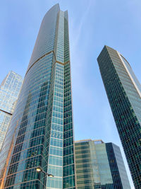 Low angle view of modern buildings against sky