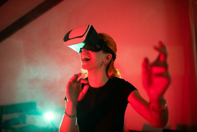 Young woman wearing sunglasses at music concert