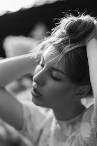 Close-up of girl tidying up her hair