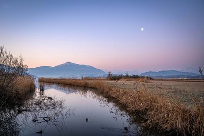 Scenic view of lake against sky on morning 