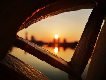 Close-up of sea against sky during sunset