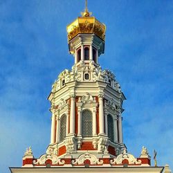 Low angle view of built structure against blue sky