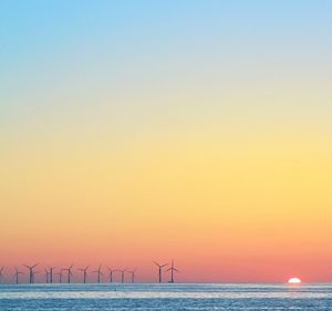 Scenic view of sea against sky at sunset