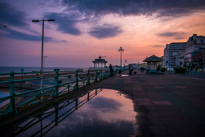 View of bridge over sea against cloudy sky