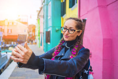 Young woman using mobile phone