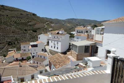 Rooftops in the white village of el borge in southern spain 