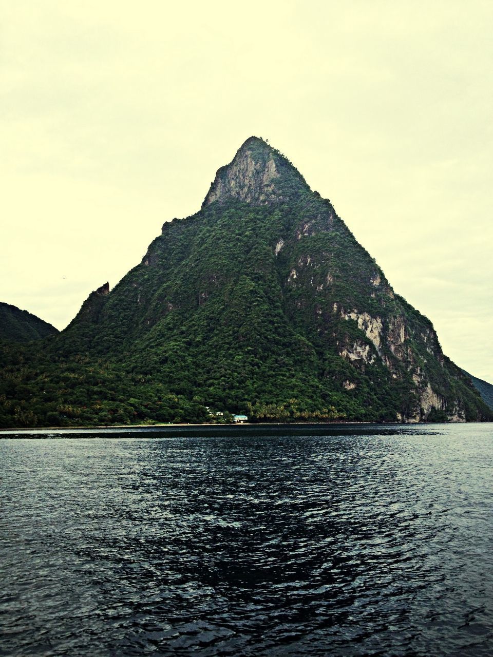 mountain, water, waterfront, tranquil scene, scenics, mountain range, tranquility, beauty in nature, lake, sky, nature, rippled, idyllic, sea, non-urban scene, river, day, outdoors, rock formation, remote