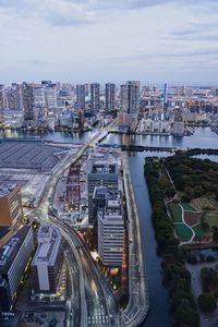 High angle view of bridge and buildings against sky