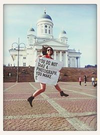 Woman standing against wall