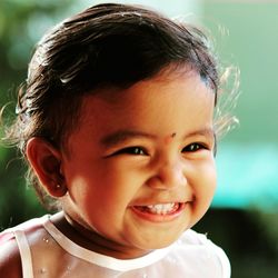 Close-up portrait of smiling boy