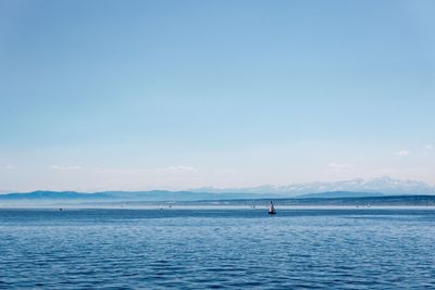 View of calm sea against blue sky