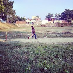 Girl standing on grass in park