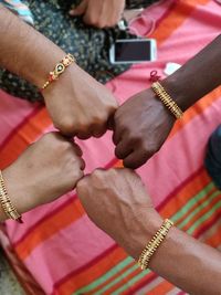 High angle view of people holding hands