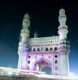 Low angle view of illuminated building at night