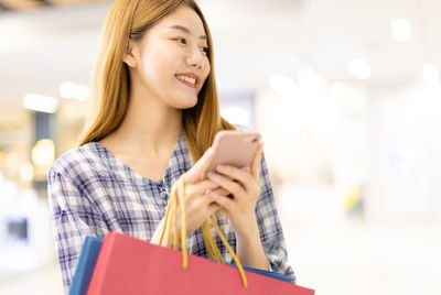 Young woman using mobile phone