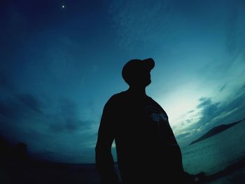 Low angle view of silhouette man against sky at dusk