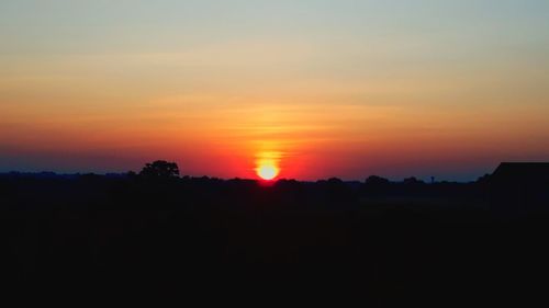 Scenic view of silhouette landscape against sky during sunset