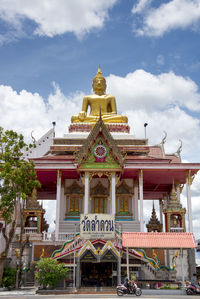 Big buddha on rooftop in nong khai province, thailand. low angle.