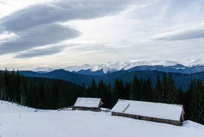 Scenic view of mountains against sky during winter