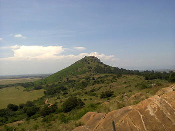 Scenic view of mountain against cloudy sky