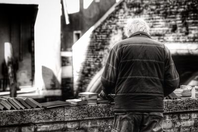 Rear view of woman standing in park