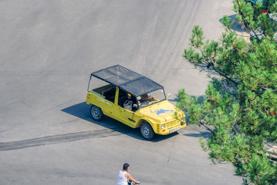 High angle view of man by yellow road