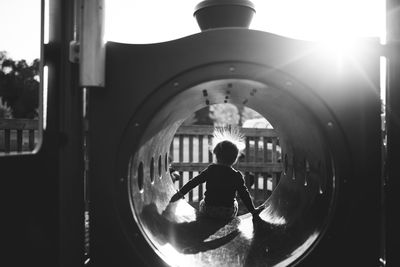 Silhouette of girl playing at park