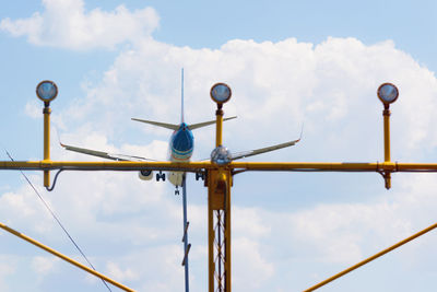 Low angle view of airplane against sky