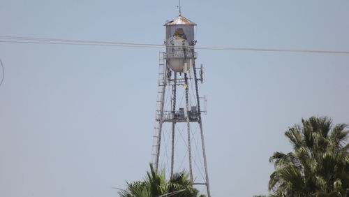 Low angle view of communications tower against clear sky