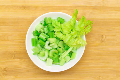 High angle view of chopped vegetables in bowl on table