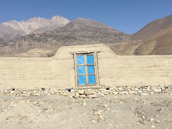 Built structure with mountain range in background