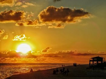 Scenic view of beach against sky during sunset