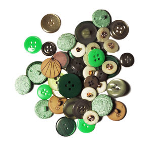 High angle view of various buttons on white background