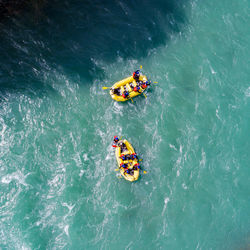 High angle view of people in boat on sea