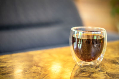 Close-up of wine glass on table