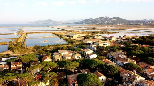 High angle view of houses and buildings against sky