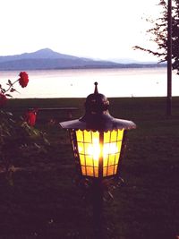 View of illuminated street light at sunset