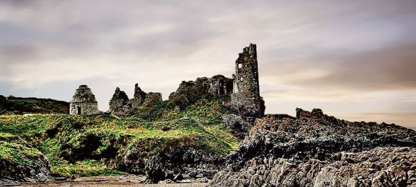 Panoramic view of rocks and trees against sky
