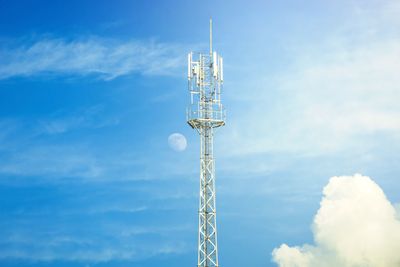 Low angle view of communications tower against sky