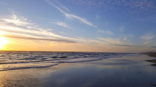 Scenic view of sea against sky at sunset